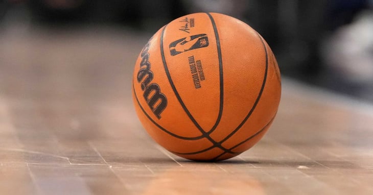 A basketball sitting on a court